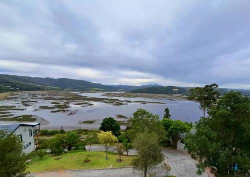 an aerial view of a large lake with trees at Aquila Chalet Phantom Views in Knysna