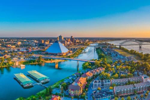 an aerial view of a city with a river at Cozy Delightful Private Studio near Rhodes College, Shuttle, & Vehicle Rental in Memphis