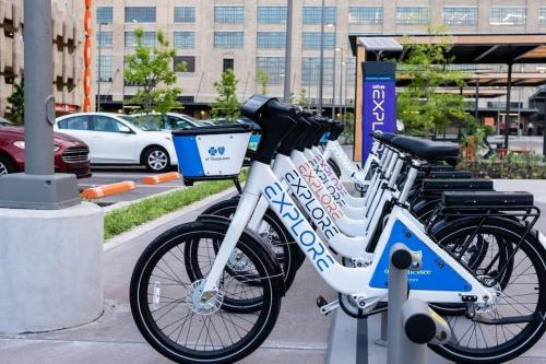 a row of bikes parked next to a parking lot at Cozy Delightful Private Studio near Rhodes College, Shuttle, & Vehicle Rental in Memphis