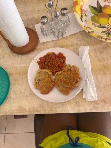 a plate of food on a table with a plate of food at Peaceful Palms Montego Bay in Montego Bay