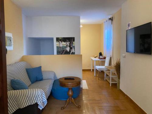 a living room with a couch and a table at Familia anfitriona acoge in Seville