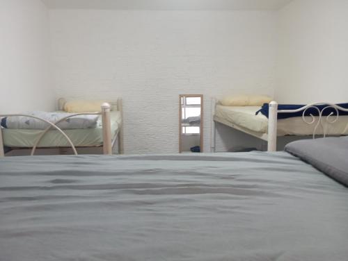 Katil dua tingkat atau katil-katil dua tingkat dalam bilik di Casa Família Planet Hostel casa completa para 8 pessoas