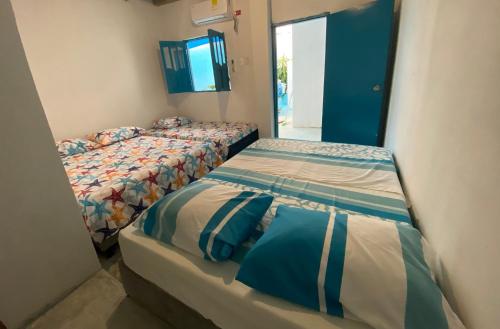 Postel nebo postele na pokoji v ubytování Casa Santorini