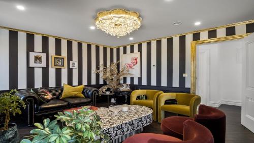 a living room with a black and white striped wall at Sweet Garden, Mannin - Ballyconneely in Ballyconneely