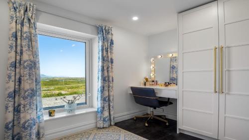 a home office with a desk and a window at Sweet Garden, Mannin - Ballyconneely in Ballyconneely