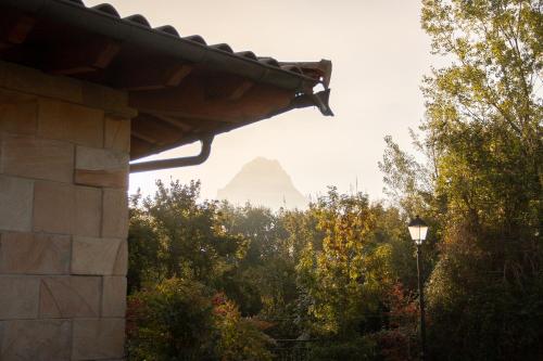 a view of the sugarloaf mountain from a house at OLATZEA LANDA HOTELA in Arbizu