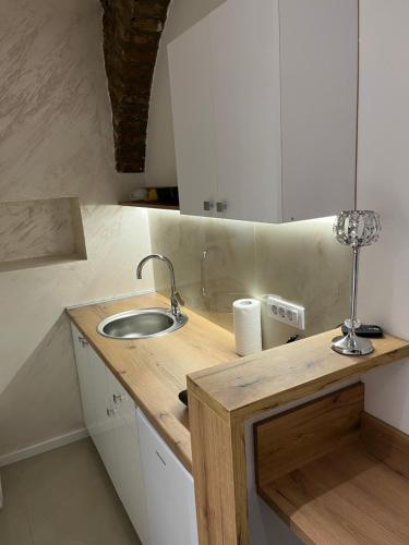 a kitchen with a sink and a counter top at Dream House in Novi Sad