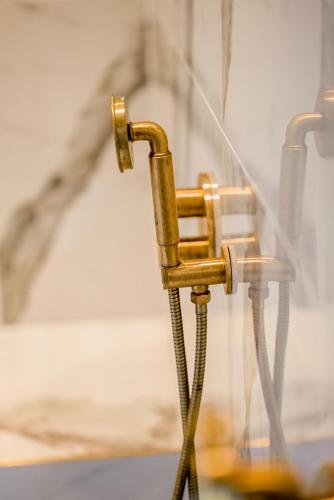 a close up of a metalaucet on a wall at Hunton Park Hotel in Kings Langley