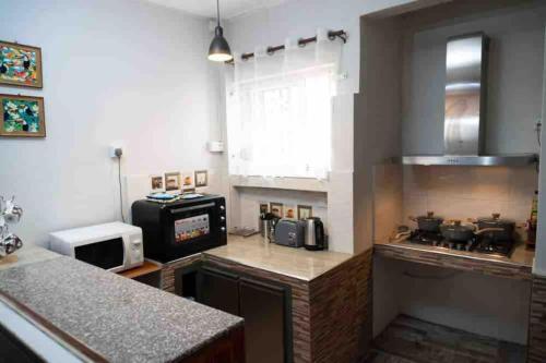 a kitchen with a sink and a counter top at Vythee Residence in Chemin Grenier