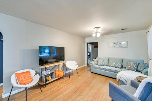 a living room with a couch and a tv at Dry Ridge Rental Home with Hot Tub and Game Room! in Dry Ridge