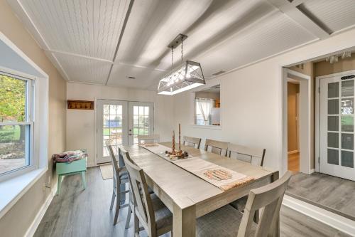 a dining room with a large wooden table and chairs at Dry Ridge Rental Home with Hot Tub and Game Room! in Dry Ridge