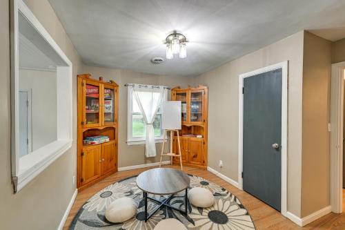 a living room with a table and a door at Dry Ridge Rental Home with Hot Tub and Game Room! in Dry Ridge