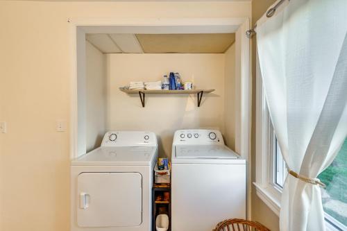 a laundry room with a washer and dryer and a window at Dry Ridge Rental Home with Hot Tub and Game Room! in Dry Ridge
