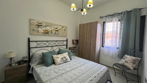 En eller flere senge i et værelse på Green Home-Tenerife Sur