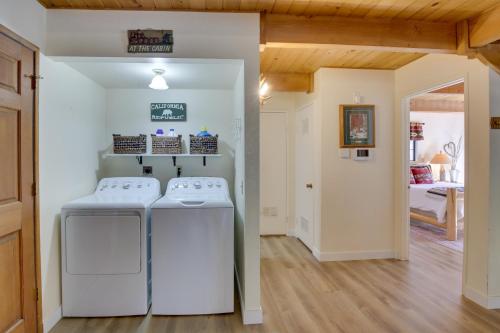 a laundry room with two washing machines and a bedroom at Dancing Bear Lodge about 1 Mi to Big Bear Lake! in Big Bear Lake