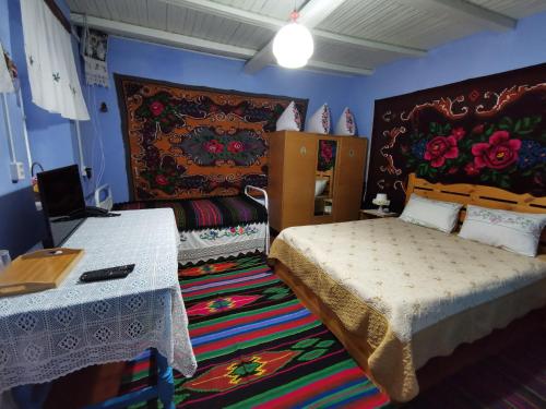 Кровать или кровати в номере La Mădălina