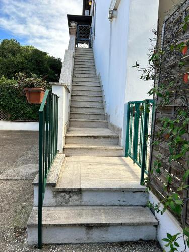 a set of stairs leading up to a building at Oasi di Mare next Rome Airport in Fregene