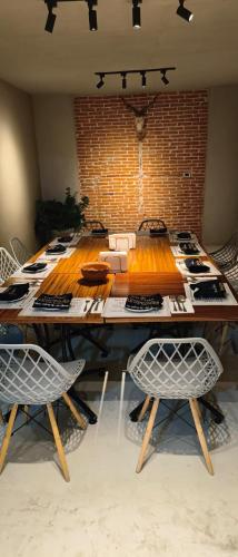 a large wooden table with chairs in a room at Hotel Garcia Peral in Huajuapan de León