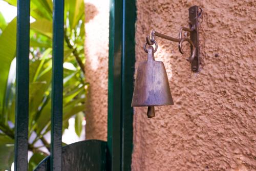 a bell on the side of a gate at VILLA - APA II in Gythio