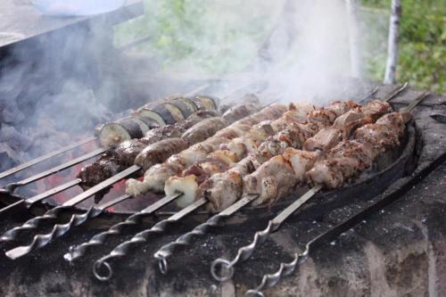 a bunch of meat and vegetables on a grill at Home-restaurant in Vanadzor in Vanadzor
