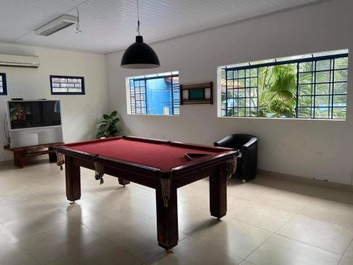 a living room with a pool table in it at Pousada Canto dos Passaros in Chapada dos Guimarães