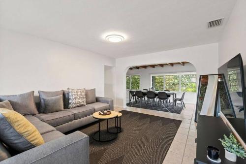 a living room with a couch and a table at 3br Oasis near Coral Gable in Miami