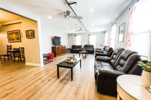 a living room with a couch and a table at Unique Large 9BR House with 3 Bath Close to the falls in Niagara Falls