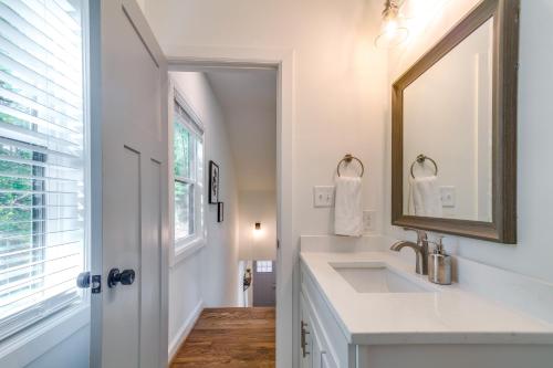 a bathroom with a sink and a mirror at Durham Vacation Rental 1 Mi to Duke University! in Durham