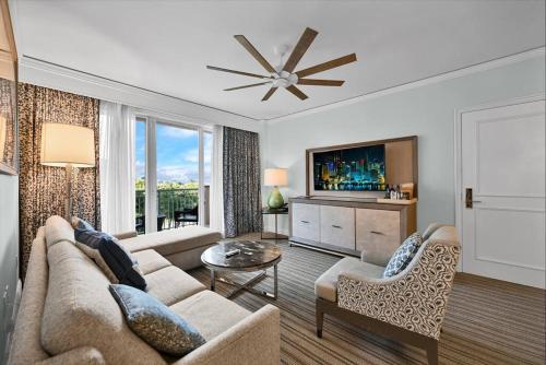 a living room with a couch and a tv at Stylish Suite to Have a Great Stay! in Miami