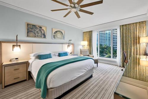 a bedroom with a large bed and a large window at Stylish Suite to Have a Great Stay! in Miami