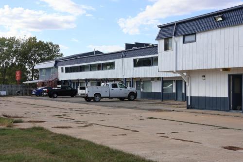 a white truck parked in front of a building at Hotel O Oskaloosa Near Eddyville in Oskaloosa