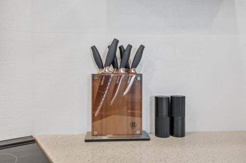 a knife block with knives in it on a counter at Downtown Luxury 1BR Coal Harbour in Vancouver