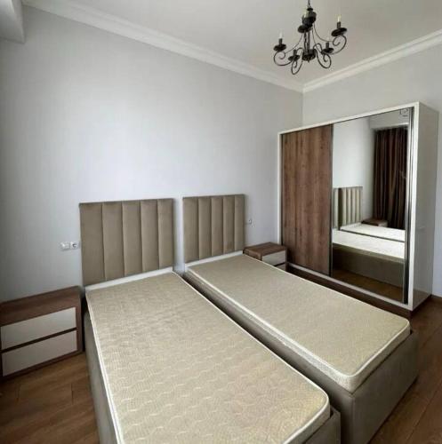a bedroom with a large bed and a mirror at Erik relax home 2 