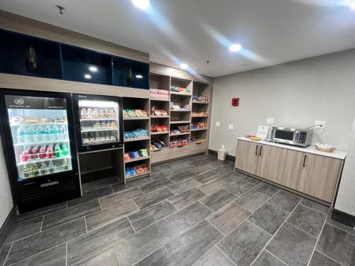 a store room with a refrigerator and a microwave at DoubleTree by Hilton Livermore, CA in Livermore