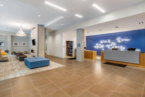 a living room with a blue wall and a couch at Residence Inn Providence Downtown in Providence