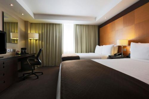 Letto o letti in una camera di Krystal Urban Aeropuerto Ciudad de Mexico