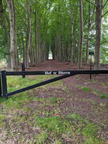 a black fence with a sign that reads hot to driven at Villa Benvenuto in Dieren