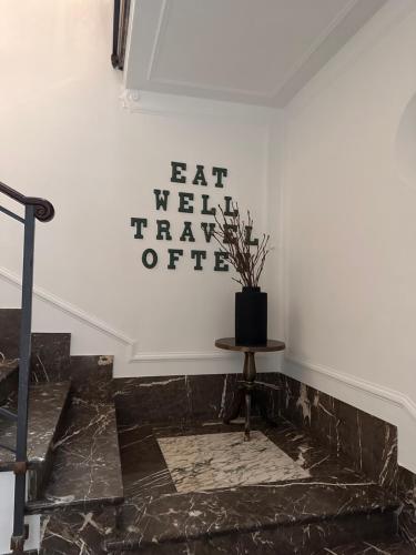 a stairwell with a potted plant on a wall at Botta 9 in Bergamo