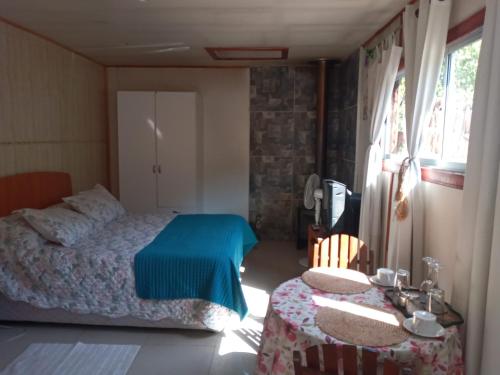 Cama ou camas em um quarto em Cabaña Alfalfal