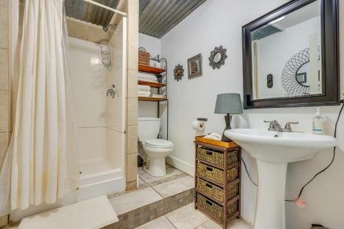 a bathroom with a sink and a toilet and a shower at Bohemian New Braunfels Home with River Access! in New Braunfels