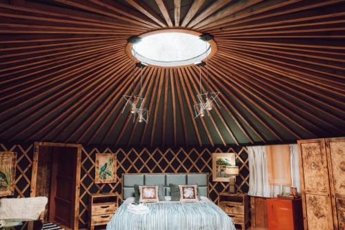 a room with a black ceiling with a bed in it at Glamping montain experience in São Joaquim