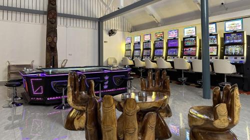 a casino with a bunch of bowling shoes in a room at Coconut Palms Resort & Diamond Casino in Port Vila