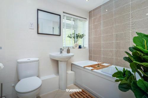 a bathroom with a toilet and a sink and a tub at NEW Canalside House / 3 Bedroom House in Stoke-on-Trent in Stoke on Trent