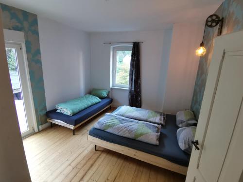 Katil atau katil-katil dalam bilik di Ferienhaus Stahlbergblick