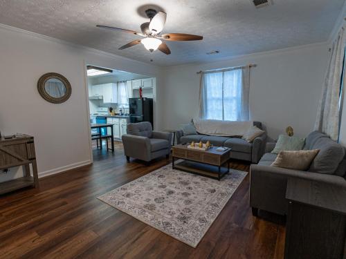a living room with a couch and a table at Columbus air pad in Columbus