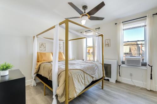 a bedroom with a canopy bed and a ceiling fan at Philadelphia Vacation Rental about 4 Mi to Center City in Philadelphia