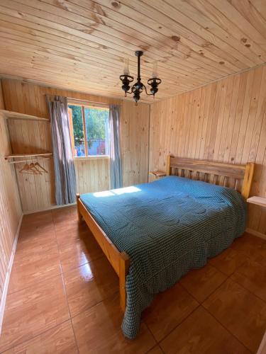 A bed or beds in a room at CABAÑAS RUCA MALAL