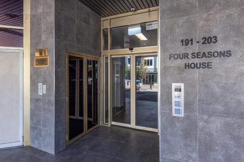a building with the entrance to a four seasons house at Tuggeranong Short Stay #11C - Sleeps 8 in Canberra