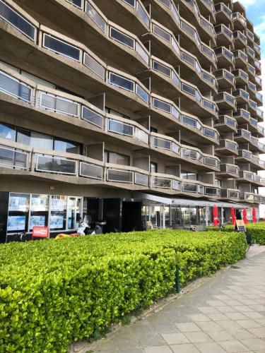 a large building with balconies on the side of it at Enjoy@sea in Ostend