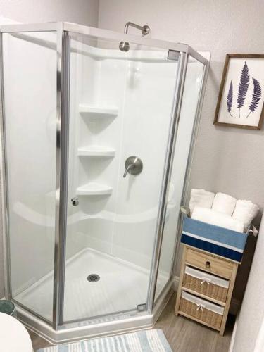 a shower with a glass enclosure in a bathroom at 1 BD Apt close to Disney/Universal/Shopping/Dining in Kissimmee